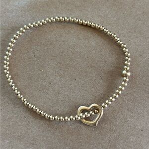 Like new gold Enewton classic gold 2mm bracelet love charm